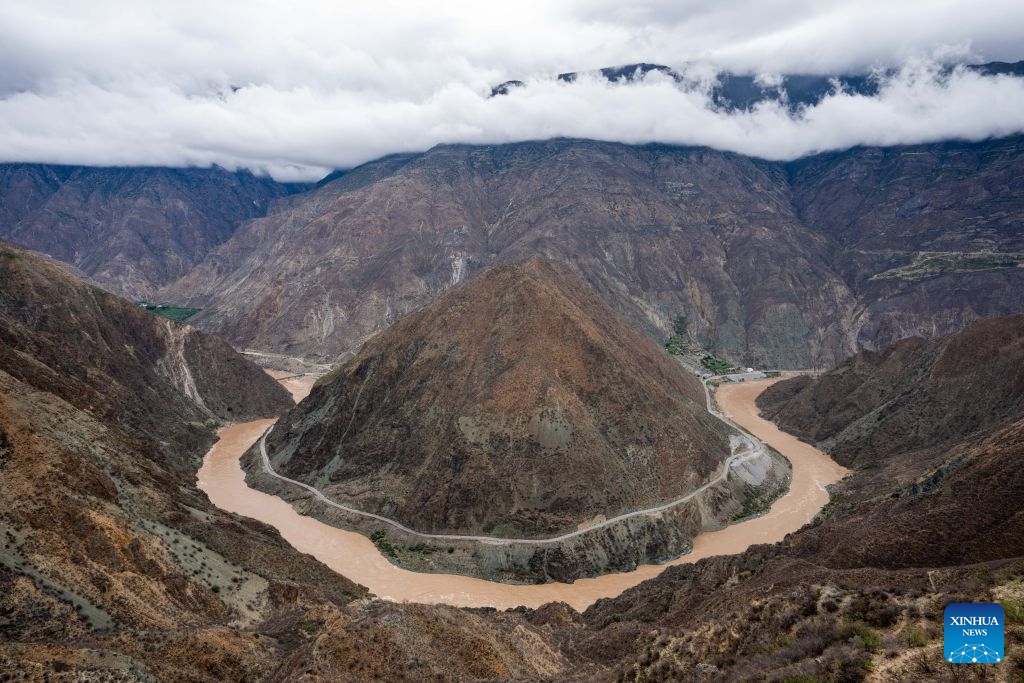 An aerial drone photo taken on July 1, 2026 shows a bend of the Jinsha River, the upper section of the Yangtze River, southwest China's Yunnan Province. On July 6, 1976, the Yunnan-Xizang Highway, a vital trunk road in China's southwestern border regions, was fully completed and opened to traffic. (Photo: Xinhua)