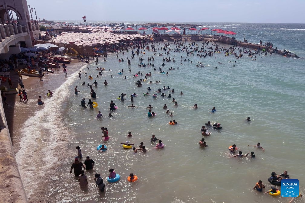 People cool off on a beach along the Mediterranean coast during a heatwave in Alexandria, Egypt, on July 6, 2026. (Photo: Xinhua)