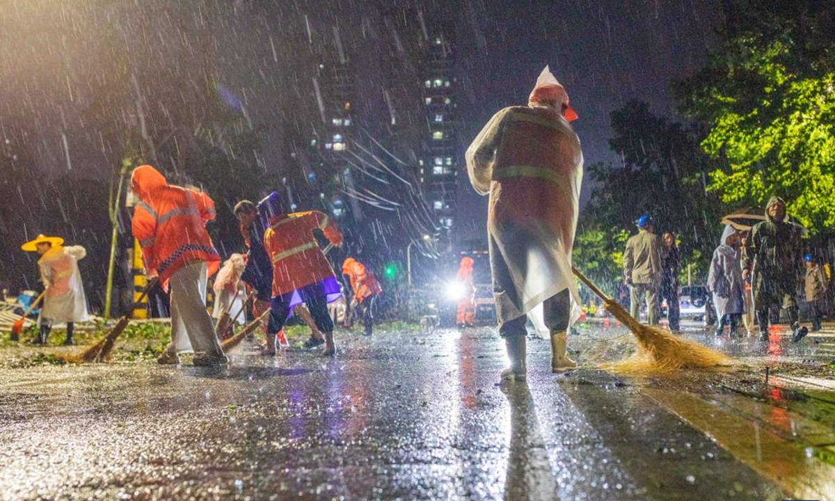 Sanitation workers clear a street in Erzhou city, Central China's Hubei Province, on July 6, 2026. Photo: Xinhua News Agency