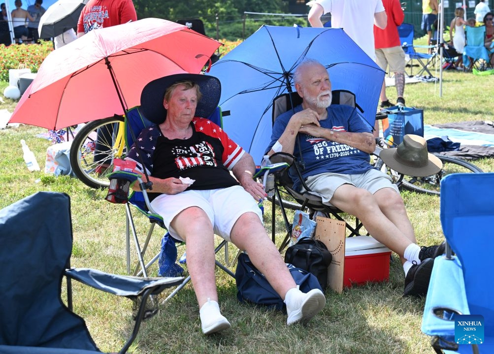 People wait for a flyover and a fireworks show to celebrate the 250th anniversary of the founding of the United States at a park in Arlington, Virginia, the United States, on July 4, 2026. (Photo: Xinhua)