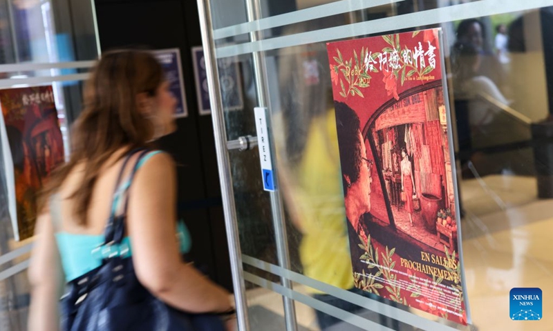 A girl walks past a poster of the Chinese film Dear You in Paris, France, July 5, 2026. China's word-of-mouth movie sensation Dear You held its French premiere in Paris on Sunday. (Photo: Xinhua)