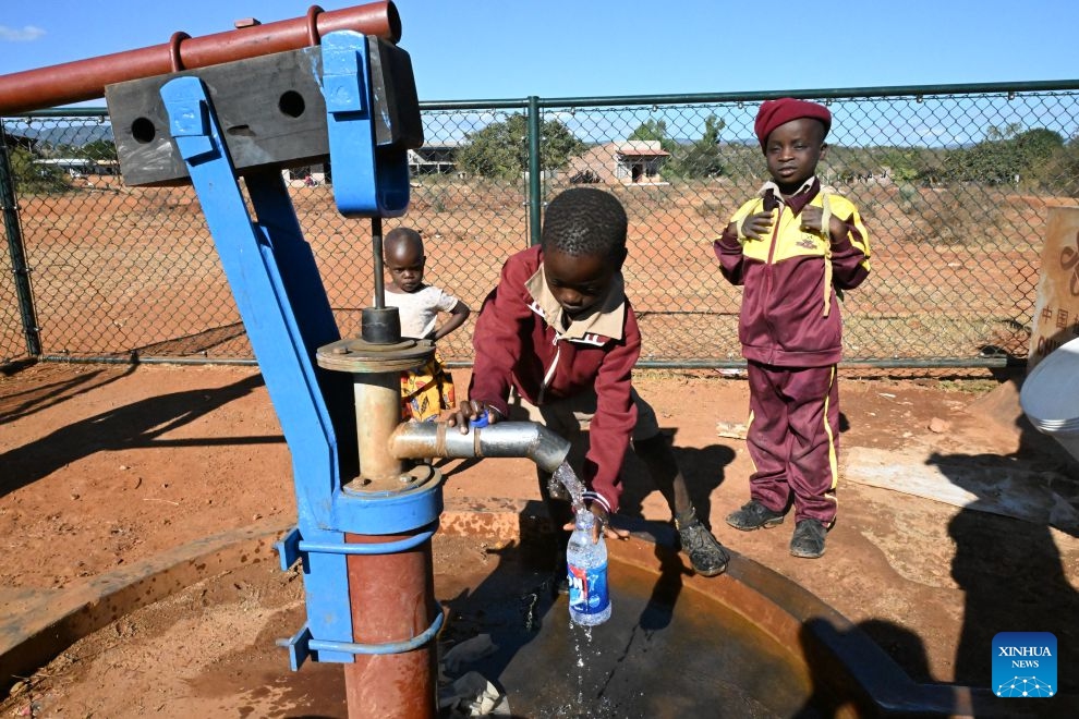 A child fetches water from a China-aided hand pump in Bumba Village, Manicaland, Zimbabwe, June 29, 2026. (Photo: Xinhua)