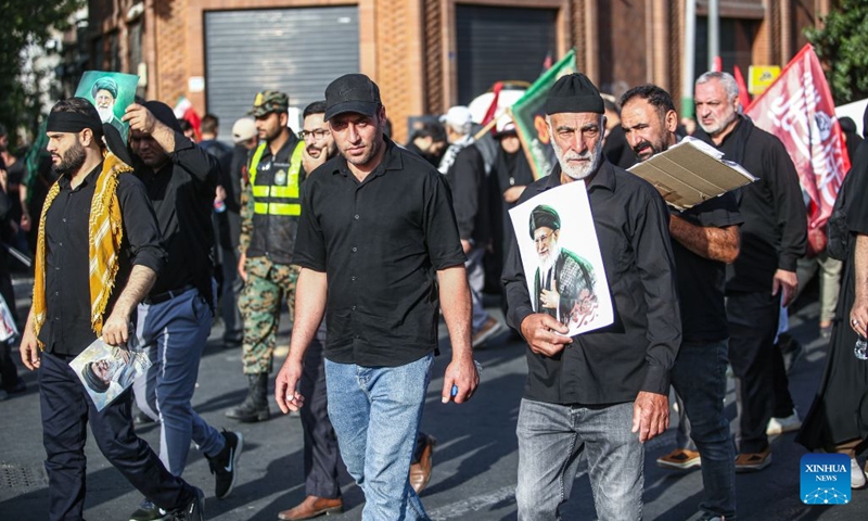 People take part in a procession to bid farewell to Iran's late Supreme Leader Ali Khamenei in Tehran, Iran, July 6, 2026. (Photo: Xinhua)