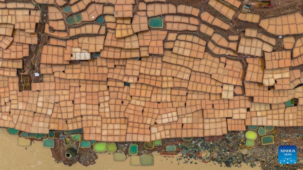 An aerial drone photo taken on July 1, 2026 shows salt fields alongside Lancang River in Mangkam County, Qamdo, southwest China's Xizang Autonomous Region. On July 6, 1976, the Yunnan-Xizang Highway, a vital trunk road in China's southwestern border regions, was fully completed and opened to traffic. (Photo: Xinhua)