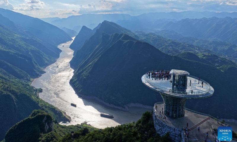 This aerial drone photo shows tourists enjoying the scenery on a skywalk at Wuxiakou scenic area in Badong County, central China's Hubei Province, July 6, 2026. (Photo: Xinhua)