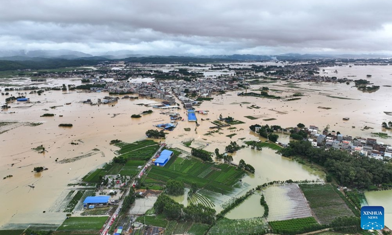 A drone photo taken on July 6, 2026 shows the flooded downstream areas of the Liulan Reservoir after it was breached due to heavy rains in Hengzhou, Nanning City, south China's Guangxi Zhuang Autonomous Region. A severe breach occurred at a reservoir in Hengzhou, Nanning City, in south China's Guangxi Zhuang Autonomous Region on Monday morning, prompting an immediate escalation of the emergency response, local authorities said. Given the severe flood control situation, the city raised its emergency response for flood control from Level III to Level I, effective at 11:30 a.m. on Monday. (Photo: Xinhua)