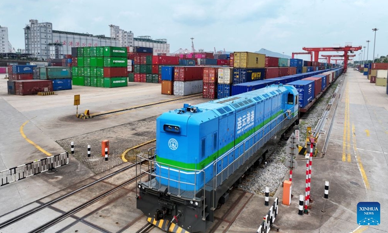 An aerial drone photo shows an international freight train loaded with auto parts at the China-Kazakhstan (Lianyungang) Logistics Cooperation Base in Lianyungang, east China's Jiangsu Province, July 6, 2026. An international freight train loaded with auto parts departed from the China-Kazakhstan (Lianyungang) Logistics Cooperation Base for Uzbekistan on Monday, marking the 8,000th international freight train handled by the base since its operation. (Photo: Xinhua)