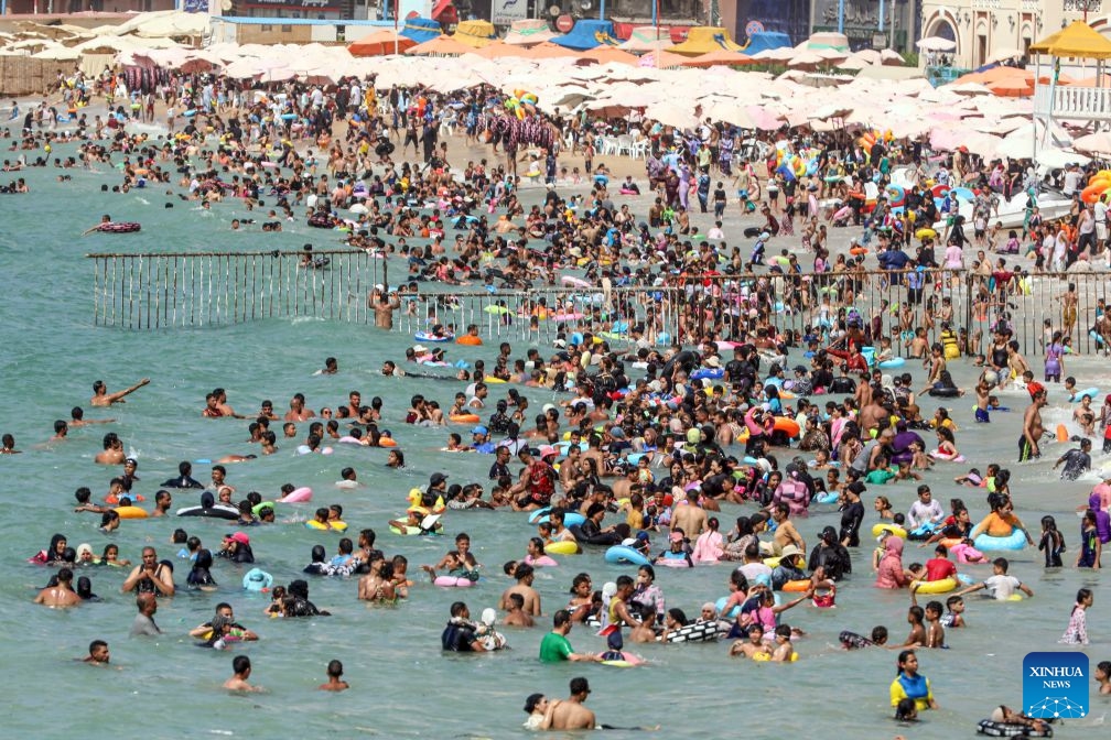 People cool off on a beach along the Mediterranean coast during a heatwave in Alexandria, Egypt, on July 6, 2026. (Photo: Xinhua)