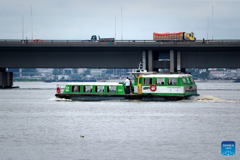 This photo taken on July 6, 2026 shows a view of the Ebrie Lagoon in Abidjan, Cote d'Ivoire. The Ebrie Lagoon, covering an area of about 560 square kilometers in southern Cote d'Ivoire, is one of the most important coastal lagoon systems in West Africa. The country's economic capital, Abidjan, stretches along both shores of the Ebrie Lagoon. The lagoon not only supports port operations, waterborne transportation and fisheries, but also weaves itself into local residents' daily lives, forging the city's distinctive character. (Photo: Xinhua)