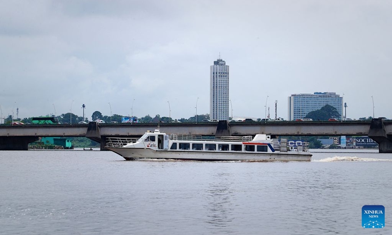 This photo taken on July 6, 2026 shows a view of the Ebrie Lagoon in Abidjan, Cote d'Ivoire. The Ebrie Lagoon, covering an area of about 560 square kilometers in southern Cote d'Ivoire, is one of the most important coastal lagoon systems in West Africa. The country's economic capital, Abidjan, stretches along both shores of the Ebrie Lagoon. The lagoon not only supports port operations, waterborne transportation and fisheries, but also weaves itself into local residents' daily lives, forging the city's distinctive character. (Photo: Xinhua)