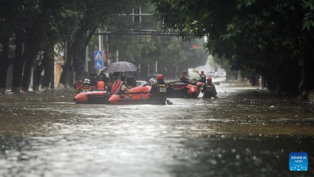 Rescuers transfer stranded residents in Qinzhou City, south China's Guangxi Zhuang Autonomous Region, July 7, 2026. Recent extreme rainstorms triggered by Typhoon Maysak, the 10th typhoon of the year, have caused severe flooding in parts of south China's Guangxi Zhuang Autonomous Region in the Pearl River basin. Earlier on Tuesday, Guangxi upgraded its flood alert to the highest-level red warning, which was quickly followed by another flood red alert issued by neighboring Guangdong Province. (Photo: Xinhua)