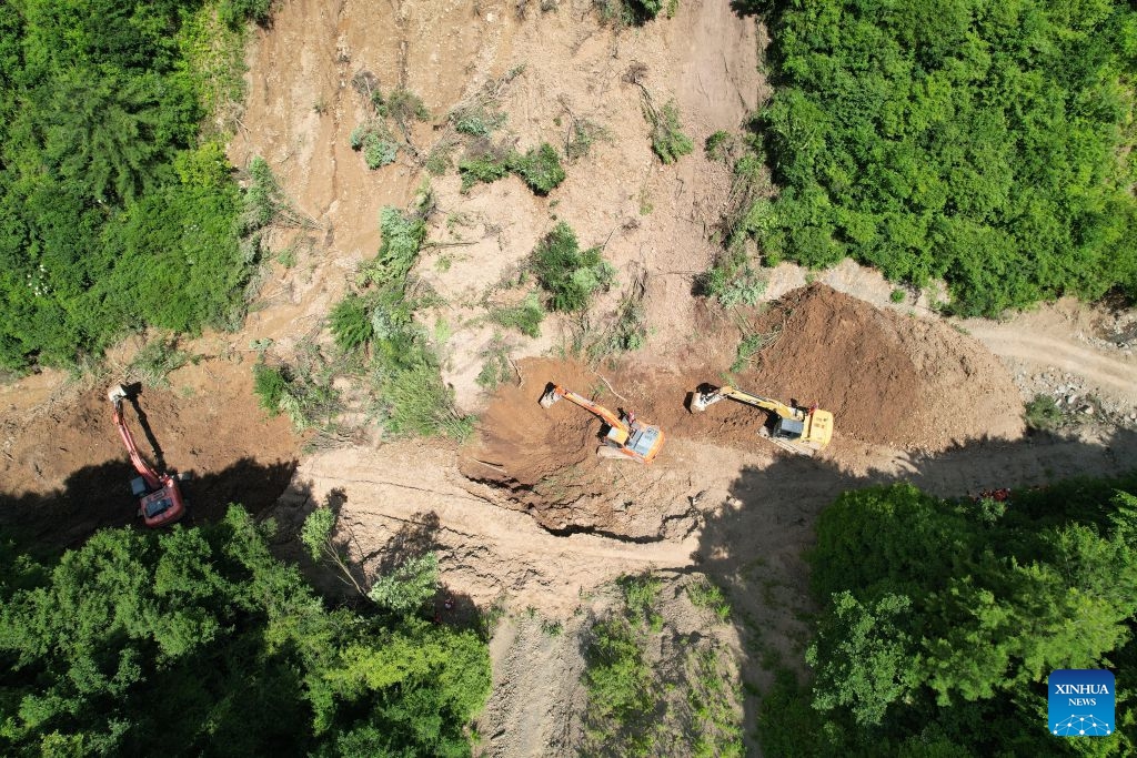An aerial drone photo taken on July 7, 2026 shows rescuers working at the site of a landslide in a village in Nanhe Township, Tanchang County, Longnan City, northwest China's Gansu Province. (Photo: Xinhua)