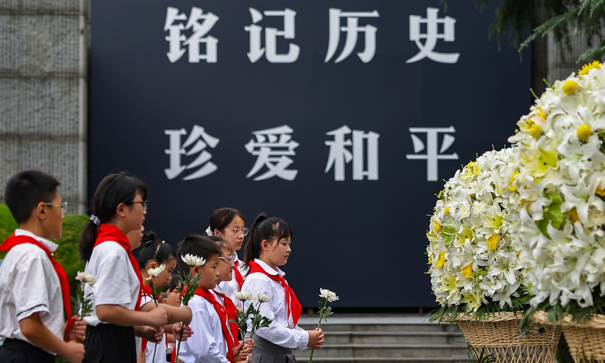 Student representatives present flowers at a commemoration ceremony for the 89th anniversary of the full outbreak of the Chinese People's War of Resistance Against Japanese Aggression at the Memorial Hall of the Victims in Nanjing Massacre by Japanese Invaders on July 7, 2026 in Nanjing, East China's Jiangsu Province. Photo: VCG