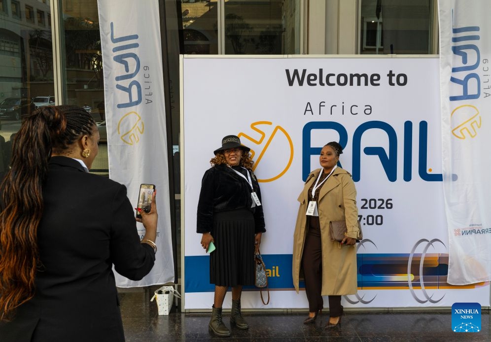 People pose for photos at the Africa Rail 2026 at the Sandton Convention Centre in Johannesburg, South Africa, July 7, 2026. The exhibition, serving as a platform for industry stakeholders to promote the collaborative development of Africa's railway sector, was held here from July 7 to 8. (Photo: Xinhua)