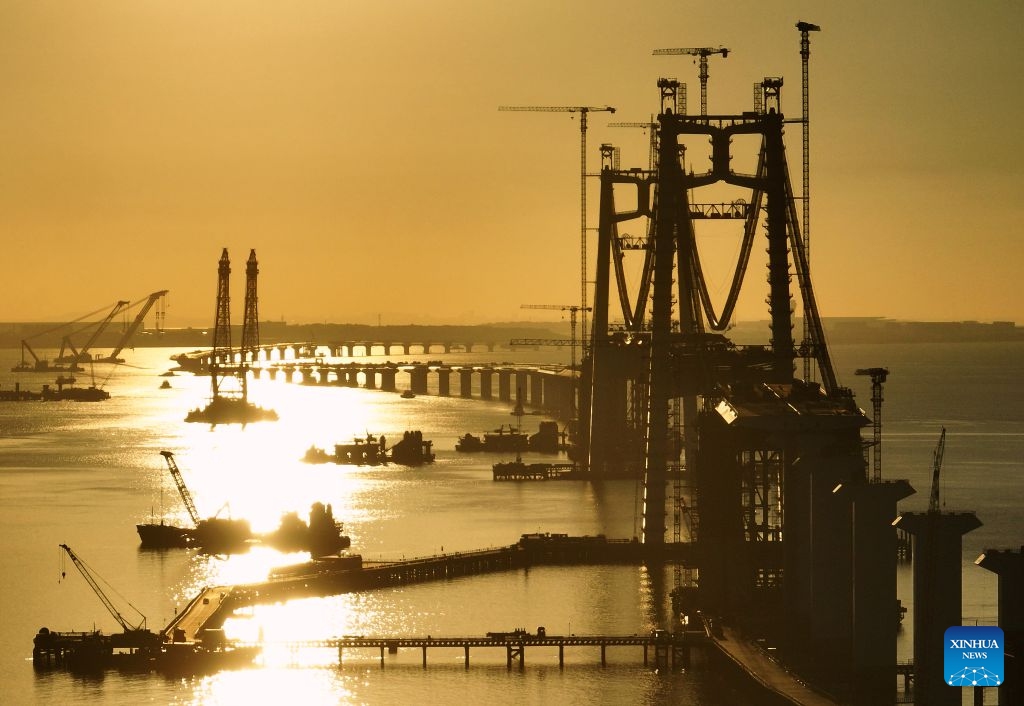 An aerial drone photo taken on July 8, 2026 shows a view of the construction site of the Xiamen section of the Xiamen-Kinmen bridge, in Xiamen, southeast China's Fujian Province. The two sides of an arch structure of Guanyinshan Interchange of the Xiamen section of the Xiamen-Kinmen bridge were joined together on Wednesday. (Photo: Xinhua)