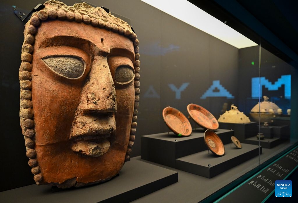 Exhibits are seen during the exhibition On Top of the World Tree: Ancient Civilizations of the Americas in Shanghai, east China, July 8, 2026. The exhibition showcases a total of 1,129 sets of precious artifacts from cultural institutions in Mexico, Peru and China. It will officially open to the public on July 9 and will run until Nov. 14, 2027. (Photo: Xinhua)