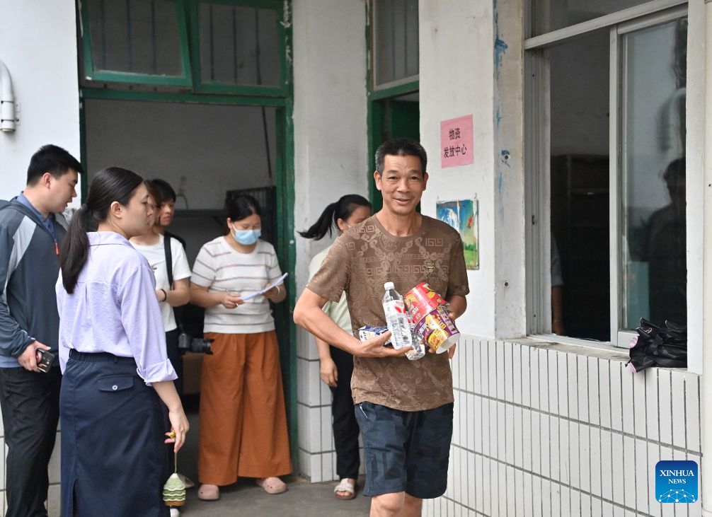Flood-affected residents receive relief supplies at a temporary relocation site in Guigang City, south China's Guangxi Zhuang Autonomous Region, July 8, 2026. Guigang has set up 18 temporary relocation sites to shelter flood-affected residents. (Photo: Xinhua)