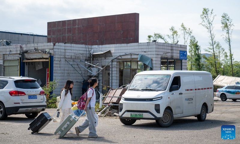 Students are evacuated from Huanggang Normal University of Huanggang City in central China's Hubei Province, July 8, 2026. A tornado struck the urban area of Huanggang City on Monday, causing damage to multiple buildings of Huanggang Normal University. Following the disaster, the university immediately carried out emergency response overnight. On Tuesday, the university started to evacuate students in batches from the campus. Currently, all resettlement and restoration efforts are progressing in an orderly manner. (Photo: Xinhua)