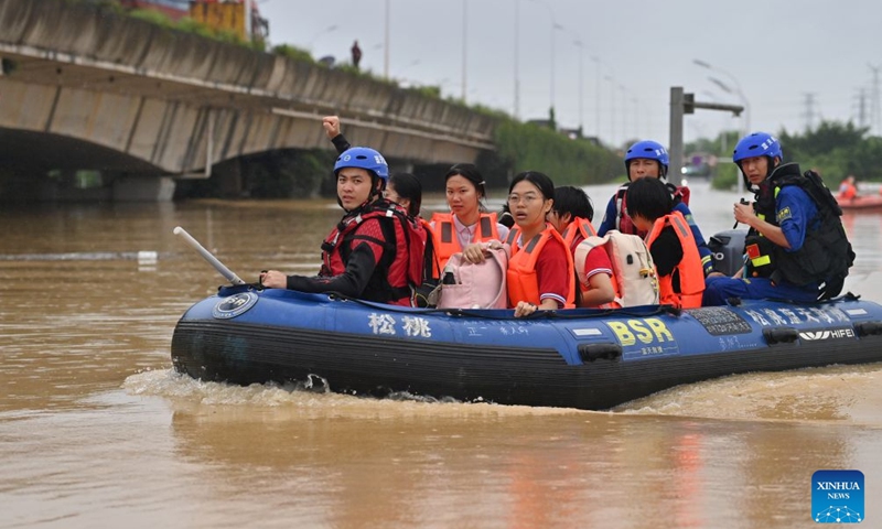 Rescuers evacuate stranded teachers and students at Xijiang education park in Guigang City, south China's Guangxi Zhuang Autonomous Region, July 8, 2026. The torrential rains caused by Typhoon Maysak left many school personnel and students trapped by floods at Xijiang education park in Guigang. Local authorities organized rescue forces to evacuate stranded teachers and students here on Wednesday. (Photo: Xinhua)