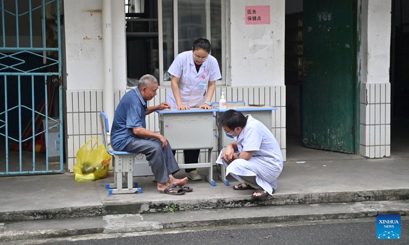 A flood-affected resident receives medical attention at a temporary relocation site in Guigang City, south China's Guangxi Zhuang Autonomous Region, July 8, 2026. Guigang has set up 18 temporary relocation sites to shelter flood-affected residents. (Photo: Xinhua)
