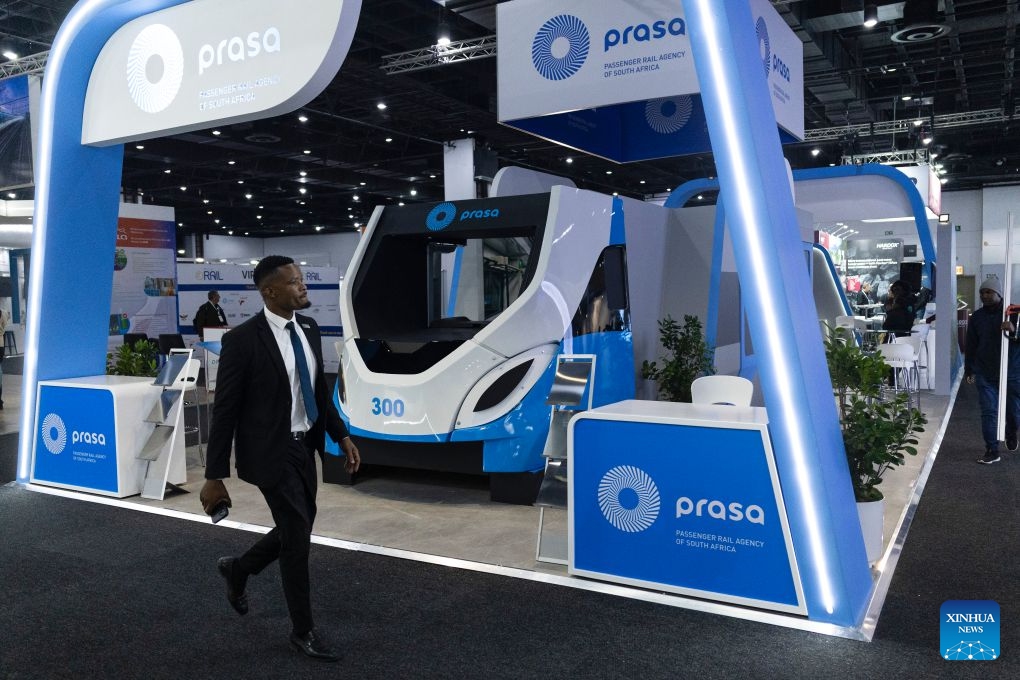 A man walks past the booth of Prasa during the Africa Rail 2026 at the Sandton Convention Centre in Johannesburg, South Africa, July 7, 2026. The exhibition, serving as a platform for industry stakeholders to promote the collaborative development of Africa's railway sector, was held here from July 7 to 8. (Photo: Xinhua)