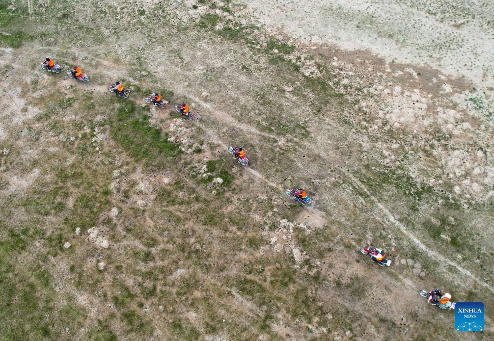 An aerial drone photo shows ecological conservation staff patrolling along the Donggi Cona Lake in Tibetan Autonomous Prefecture of Golog, northwest China's Qinghai Province, July 7, 2026. (Photo: Xinhua)