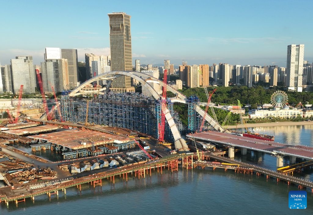 A drone photo taken on July 8, 2026 shows a view of the construction site of Guanyinshan Interchange, a project of the Xiamen section of the Xiamen-Kinmen bridge, in Xiamen, southeast China's Fujian Province. The two sides of an arch structure of Guanyinshan Interchange of the Xiamen section of the Xiamen-Kinmen bridge were joined together on Wednesday. (Photo: Xinhua)