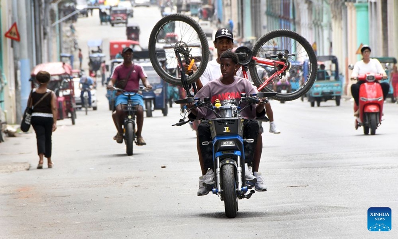 People drive on a street in Havana, capital of Cuba, on July 8, 2026. Cuban Foreign Minister Bruno Rodriguez on Tuesday accused the U.S. government of carrying out multidimensional, non-conventional warfare against Cuba, which he said has lasted for almost seven decades and become ever crueler and more ruthless during the last seven months. The cumulative damage caused by the U.S. blockade since it was first imposed amounts to 178.7 billion U.S. dollars at current prices, according to Rodriguez. (Photo: Xinhua)