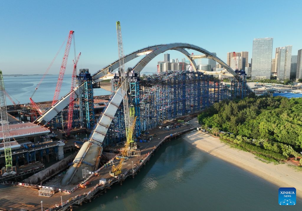 A drone photo taken on July 8, 2026 shows a view of the construction site of Guanyinshan Interchange, a project of the Xiamen section of the Xiamen-Kinmen bridge, in Xiamen, southeast China's Fujian Province. The two sides of an arch structure of Guanyinshan Interchange of the Xiamen section of the Xiamen-Kinmen bridge were joined together on Wednesday. (Photo: Xinhua)