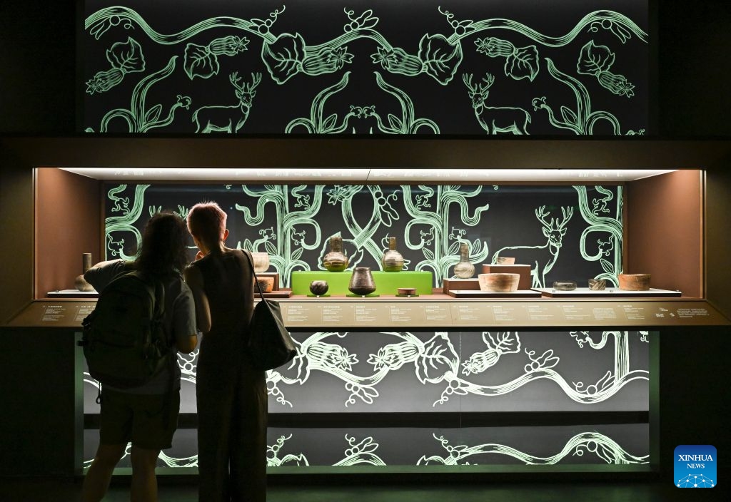 Visitors view exhibits during the exhibition On Top of the World Tree: Ancient Civilizations of the Americas in Shanghai, east China, July 8, 2026. The exhibition showcases a total of 1,129 sets of precious artifacts from cultural institutions in Mexico, Peru and China. It will officially open to the public on July 9 and will run until Nov. 14, 2027. (Photo: Xinhua)