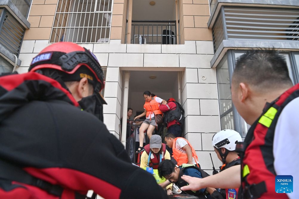 Rescuers evacuate stranded teachers and students at Xijiang education park in Guigang City, south China's Guangxi Zhuang Autonomous Region, July 8, 2026. The torrential rains caused by Typhoon Maysak left many school personnel and students trapped by floods at Xijiang education park in Guigang. Local authorities organized rescue forces to evacuate stranded teachers and students here on Wednesday. (Photo: Xinhua)