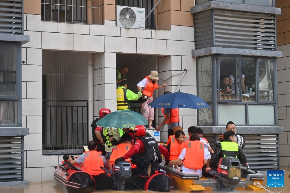 Rescuers evacuate stranded teachers and students at Xijiang education park in Guigang City, south China's Guangxi Zhuang Autonomous Region, July 8, 2026. The torrential rains caused by Typhoon Maysak left many school personnel and students trapped by floods at Xijiang education park in Guigang. Local authorities organized rescue forces to evacuate stranded teachers and students here on Wednesday. (Photo: Xinhua)