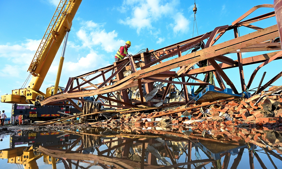 Workers carry out post-tornado rescue and reconstruction work atop the wreckage of a building damaged by a tornado in Huanggang, Central China's Hubei Province, on July 7, 2026. Photo: VCG