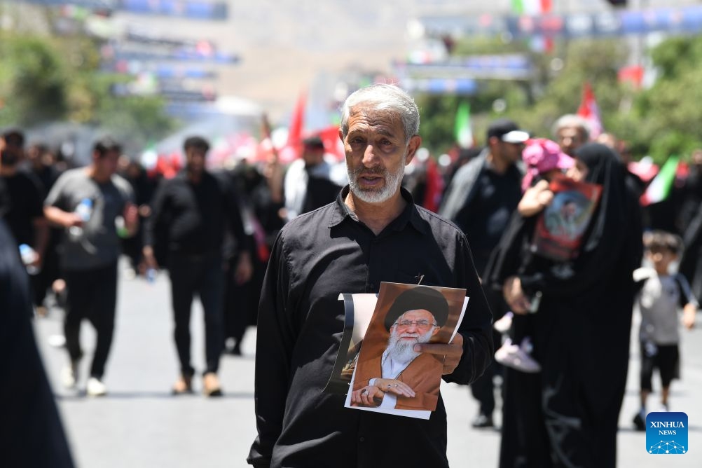 People attend the funeral procession of Iran's late Supreme Leader Ali Khamenei in Mashhad, Iran, July 9, 2026. Ali Khamenei was laid to rest in the northeastern Iranian city of Mashhad on Thursday. (Xinhua/Shadati)
