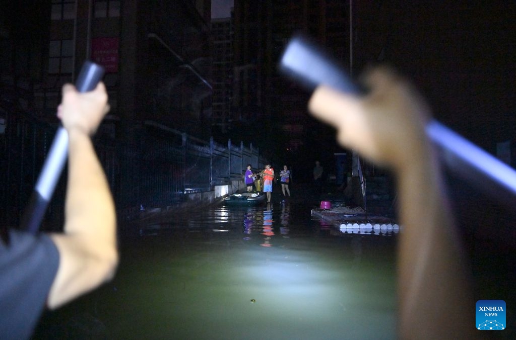 Rescuers deliver supplies to stranded residents in Guigang, south China's Guangxi Zhuang Autonomous Region, July 9, 2026.
Guigang has suffered severe flooding due to torrential rains brought by Typhoon Maysak and upstream inflows. Local authorities have mobilized rescue forces to work around the clock, making every effort to ensure basic living needs for stranded residents. (Xinhua/Zhou Hua)