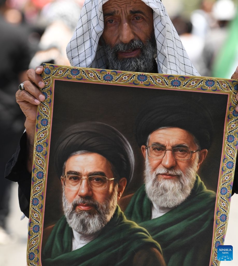 People attend the funeral procession of Iran's late Supreme Leader Ali Khamenei in Mashhad, Iran, July 9, 2026. Ali Khamenei was laid to rest in the northeastern Iranian city of Mashhad on Thursday. (Xinhua/Shadati)