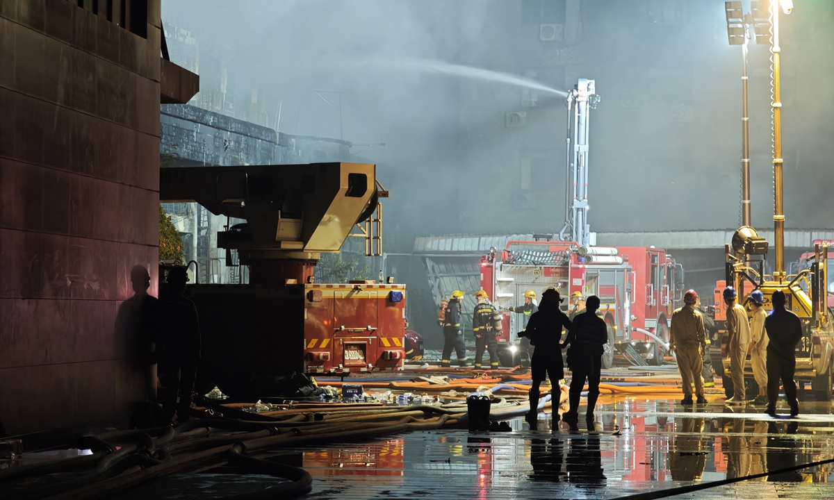 Fire trucks spray water to cool down the accident site after a fire broke out at a shoe factory in Jinjiang City, Fujian Province in Eastern China on July 9, 2026, leaving heavy casualties. Photo: Xinhua