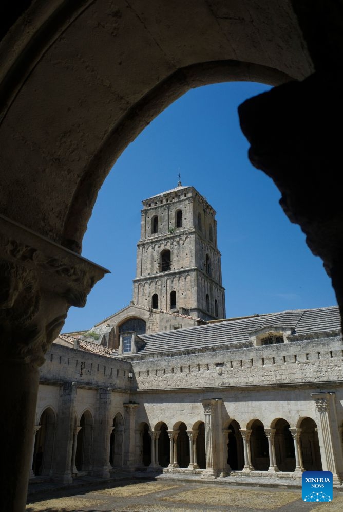 This photo taken on July 8, 2026 shows the cloister and tower of the Church of St. Trophime in Arles, France. (Xinhua/Wu Huiwo)