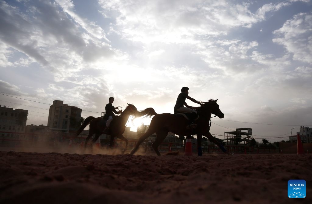 Two riders train at an equestrian club in Sanaa, Yemen, on July 9, 2026. Horse lovers and trainers gathered at an equestrian club in Yemen's capital Sanaa to promote equestrian culture and encourage horse riding ahead of World Horse Day, which falls on July 11. (Photo: Xinhua)