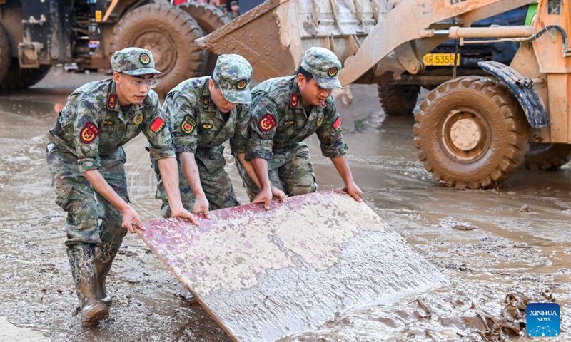 Rescuers help clear a road in Guigang, south China's Guangxi Zhuang Autonomous Region, July 10, 2026. The local authorities beef up restoration efforts after torrential rains caused by Typhoon Maysak. (Photo: Xinhua)