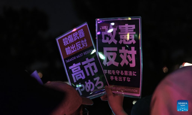 People holding signs attend a protest rally in front of the National Diet Building in Tokyo, Japan, July 10, 2026. A large number of Japanese citizens gathered in front of the National Diet Building in Tokyo on Friday evening to protest a series of dangerous policies and bills recently promoted by the government of Prime Minister Sanae Takaichi. (Photo: Xinhua)