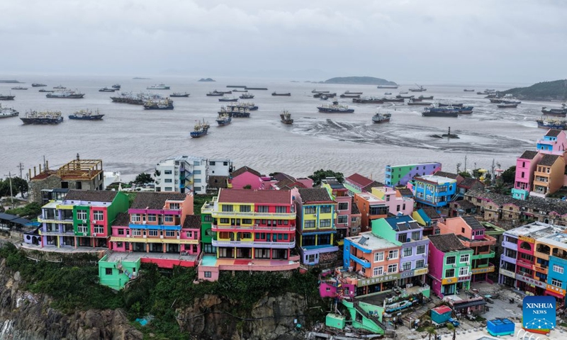 A drone photo taken on July 11, 2026 shows fishing boats docking at a port in Shitang Town of Wenling City, east China's Zhejiang Province. Typhoon Bavi, the ninth typhoon of the year, is expected to make landfall along the coast between Sanmen and Cangnan in east China's Zhejiang Province in the early hours of Sunday. In preparation, authorities at all levels in Wenling have stepped up with extra hands on duty as well as reinforced safety and prevention measures. Local emergency teams, shelters, and supplies are now fully prepared for typhoon response. (Photo: Xinhua)