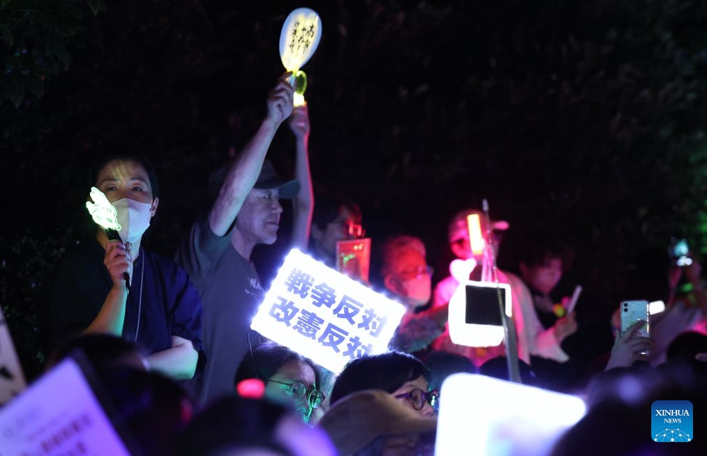 People holding signs attend a protest rally in front of the National Diet Building in Tokyo, Japan, July 10, 2026. A large number of Japanese citizens gathered in front of the National Diet Building in Tokyo on Friday evening to protest a series of dangerous policies and bills recently promoted by the government of Prime Minister Sanae Takaichi. (Photo: Xinhua)