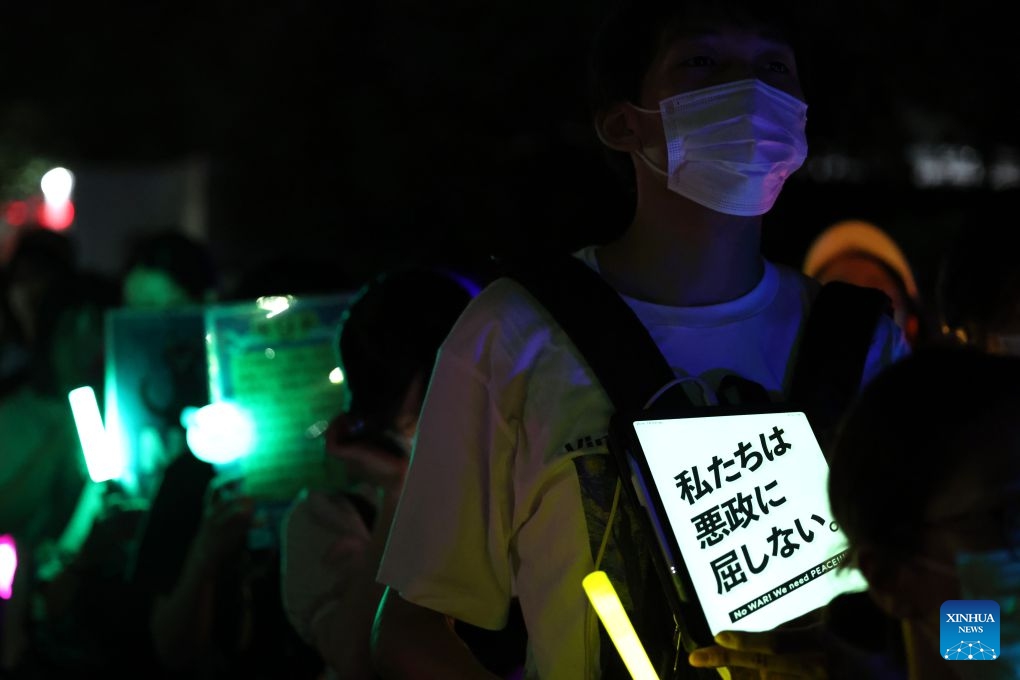 People holding signs attend a protest rally in front of the National Diet Building in Tokyo, Japan, July 10, 2026. A large number of Japanese citizens gathered in front of the National Diet Building in Tokyo on Friday evening to protest a series of dangerous policies and bills recently promoted by the government of Prime Minister Sanae Takaichi. (Photo: Xinhua)
