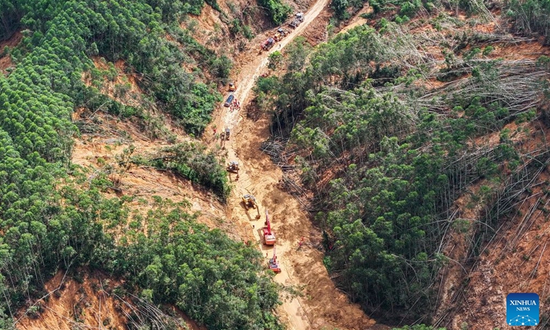 An aerial drone photo taken on July 11, 2026 shows rescuers clearing up a road leading to Zhenlong Township in Hengzhou, south China's Guangxi Zhuang Autonomous Region.(Xinhua/Huang Xiaobang)

