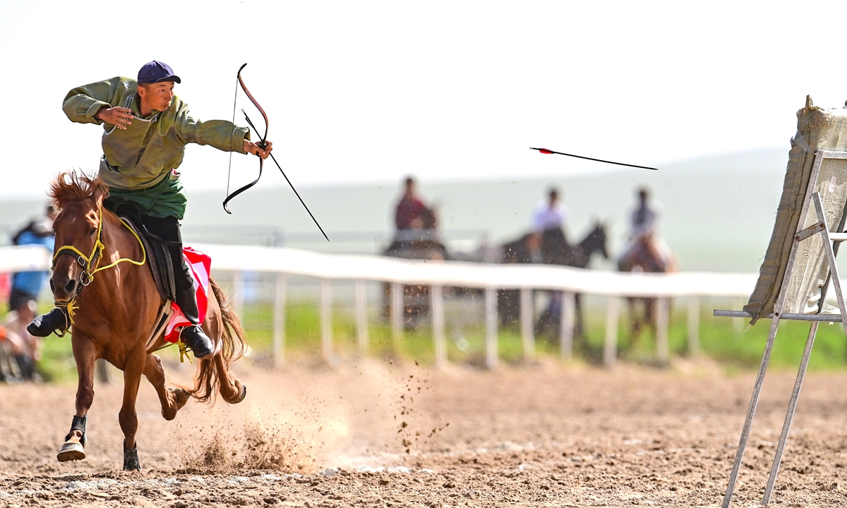 A rider competes in a horseback archery contest in Xilingol, North China's Inner Mongolia Autonomous Region, on July 12, 2026. Local riders demonstrated the skills of traditional Mongolian horseback archery, attracting a large number of tourists to watch the competition. Photo: VCG