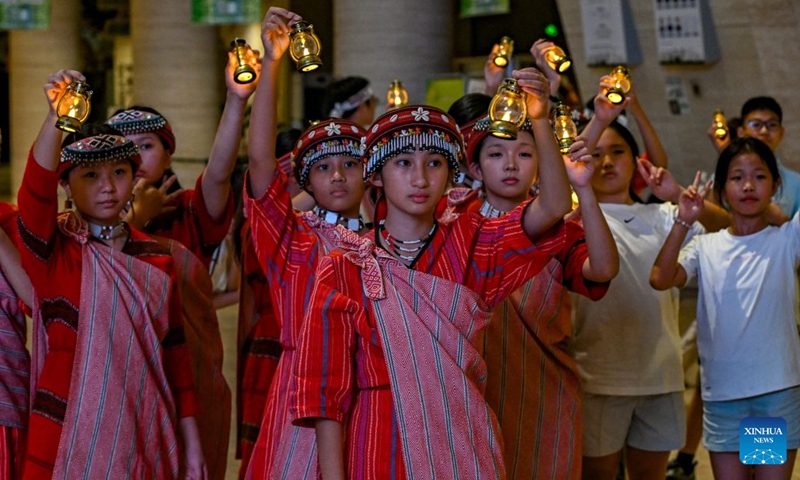 Kids from both sides of the Taiwan Strait participate in an event at the Chongqing Natural History Museum in southwest China's Chongqing Municipality, July 10, 2026. From July 9 to 12, young people from China's Taiwan and Chongqing participate in a series of cultural events in Chongqing.