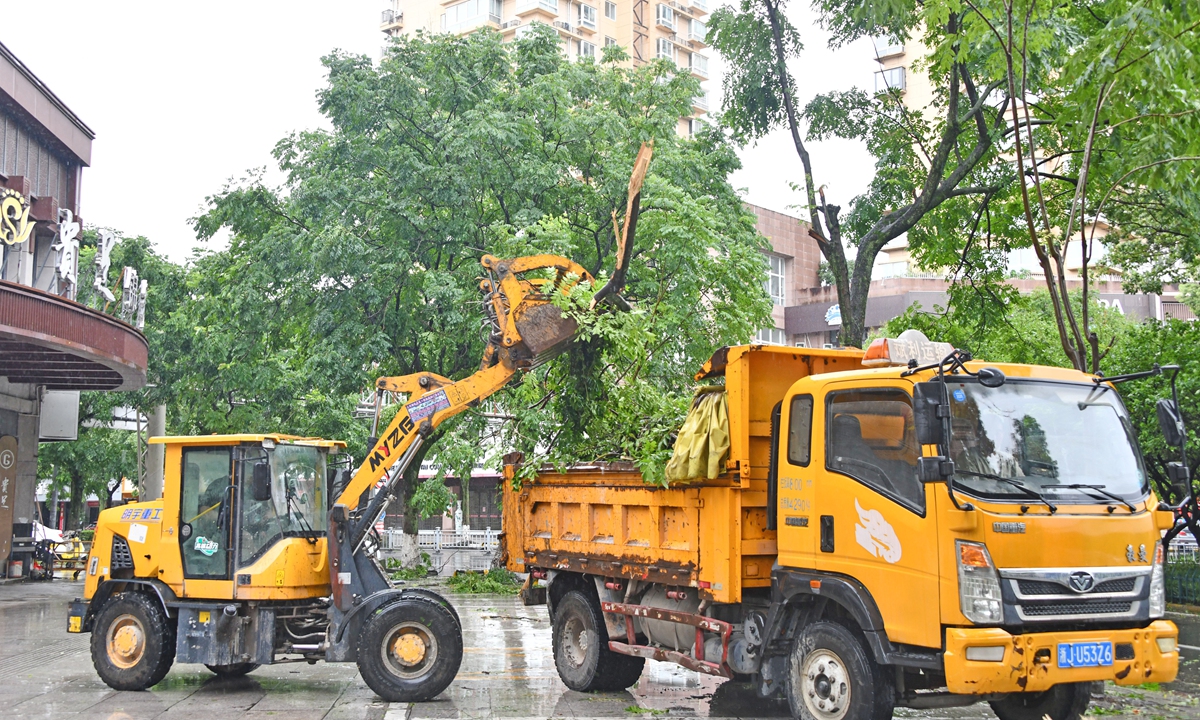 City workers clear trees toppled by Typhoon Bavi in the urban area of Xianju county, Taizhou, East China's Zhejiang Province on July 12, 2026. Photo: VCG