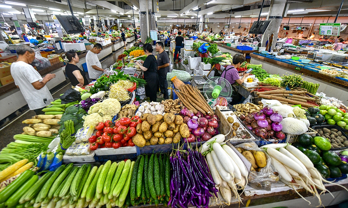 A view of a food market in Qiandaohu township, Chun'an county in Hangzhou, East China's Zhejiang Province on July 12, 2026. Despite approaching Typhoon Bavi, local markets maintain ample vegetable supplies with diverse varieties at stable prices as residents shop in orderly fashion. Photo: VCG