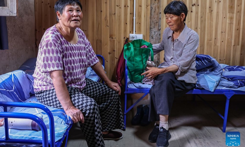 Residents rest at a shelter at Chengkan Town in Huizhou District of Huangshan City, east China's Anhui Province, July 11, 2026. (Xinhua/Chang Nengjia)